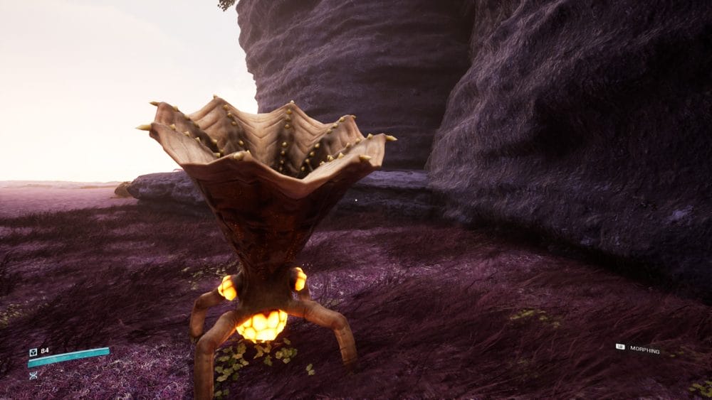 The mountain biome in Project Tower showing the protagonist morphed into an alien creature that looks like a sentient mushroom with a glowing sac on the base