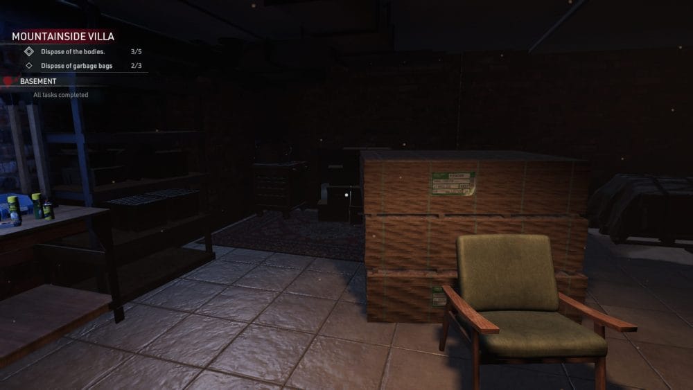 An empty green chair sitting in front of a half brick wall.