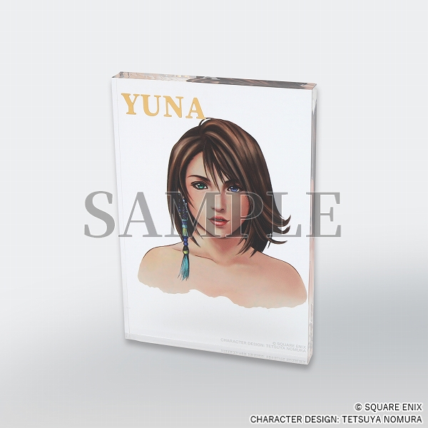 Clear acrylic block with Yuna character art at centre and her name in gold at top left.