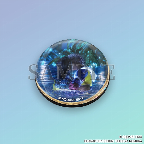 A clear glass sphere magnet with a still of Tidus and Yuna kissing in Lake Macalania.